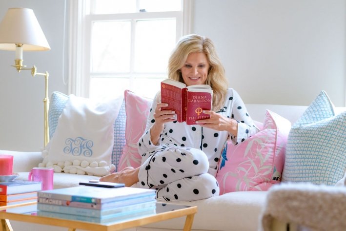 Tanya Foster holding a book in Soma cool night pajamas